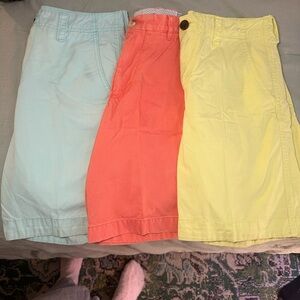 Three pair of men’s khaki shorts.